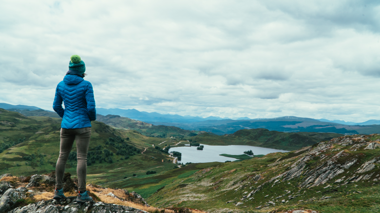 Woman in front of Highland Scenery