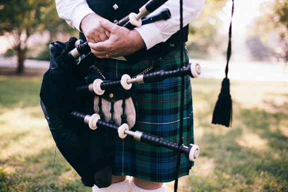Scottish bagpiper with traditional kilt